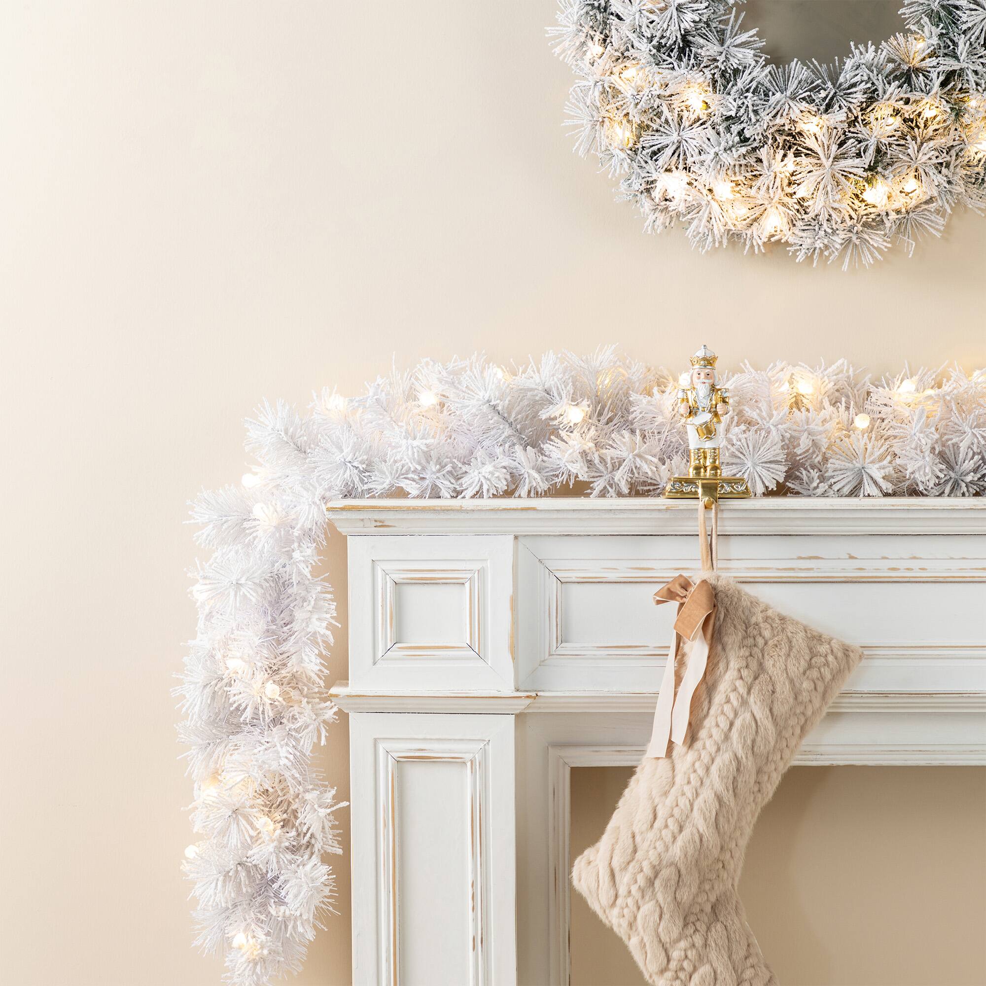 Glitzhome® 6ft Pre-Lit Snow Flocked White Pine Christmas Garland with Timer, 2ct.